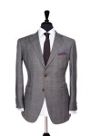 Front Mannequin view of Pocket Square's Grey Prince of Wales suit with brown button customisation